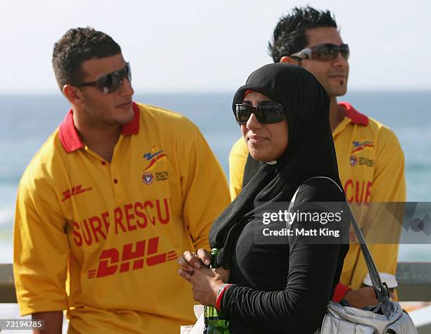 Mecca Laa Laa talks to other lifesavers before changing into a 'Burqini' before her first surf lifesaving patrol at North Cronulla Beach February 4,...