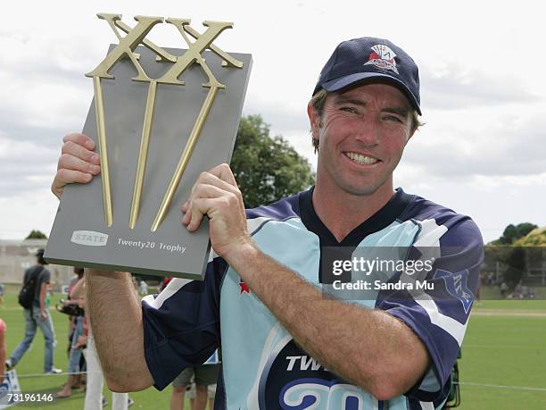 Auckland captain Richard Jones holds the trophy after Auckland beat Otago in the Twenty20 Final match between State Auckland Aces and State Otago...