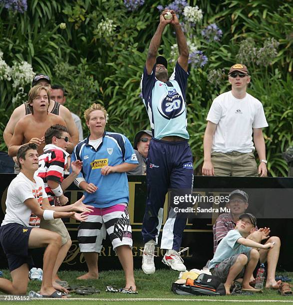 Spectators watch as Mayu Pasupati of Auckland catches the ball of Nathan McCullum of Otago during the Twenty20 Final match between State Auckland...