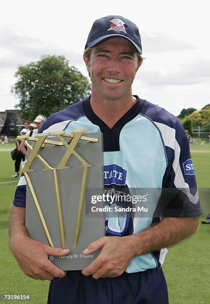 Auckland captain Richard Jones holds the trophy after Auckland beat Otago in the Twenty20 Final match between State Auckland Aces and State Otago...