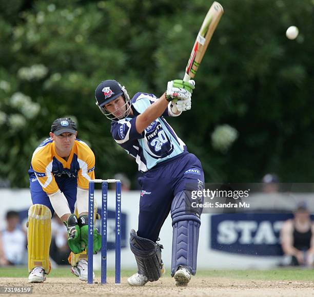 Reece Young of Auckland hits the ball during the Twenty20 Final match between State Auckland Aces and State Otago Volts at Eden Park Outer Oval...