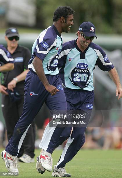 Mayu Pasupati and Richard Jones of Auckland celebrate the wicket of Craig Cumming during the Twenty20 Final match between State Auckland Aces and...