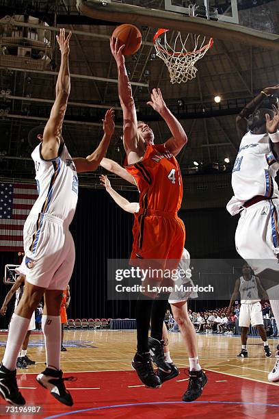 Greg Clausen of the Albuquerque Thunderbirds shoots the ball over Chris Copeland of the Fort Worth Flyers during a D-League game at the Fort Worth...