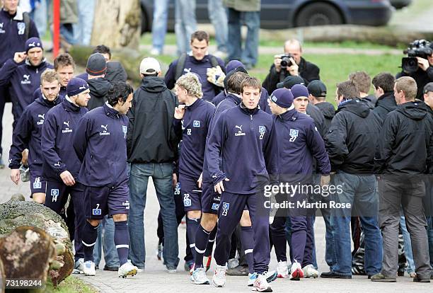 Fans of Hamburg SV block the way of the players to the training area during a Hamburger SV training session at the AOL Arena on February 04, 2007 in...