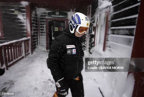 Canadian Genevieve Simard leaves a cafe after taking a break during a free training session after the women's Super-G event was cancelled, 04...