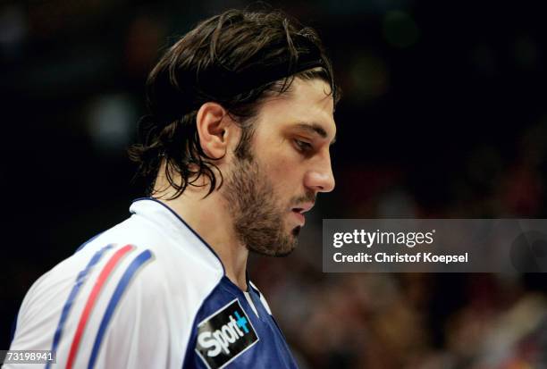 Bertrand Gille of France looks dejected during the IHF World Championship third place game between France and Denmark at the Cologne Arena on...