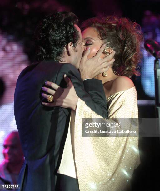 Singers Marc Anthony and Jennifer Lopez kiss on stage at The MarketAmerica.com SUPER XLI PARTY at 8th Street and Ocean Drive on February 3, 2007 in...