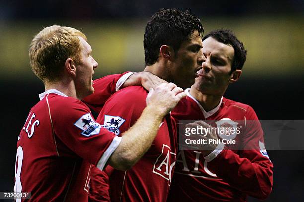 Cristiano Ronaldo of Manchester United celebrates after scoring a penalty with team mates Paul Scholes and Ryan Giggs during the Barclays Premiership...