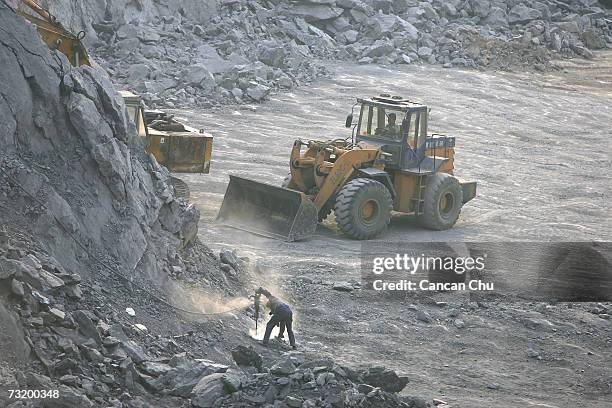 Chinese miners work at a cement factory mine February 3, 2006 in Gaoming District, Foshan City, Guangdong Province of China. China will continue...