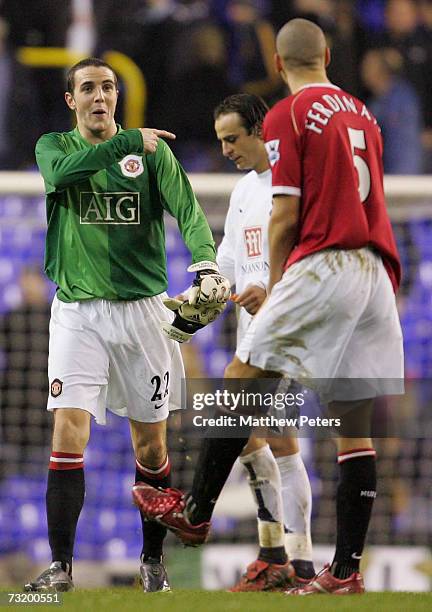 John O'Shea of Manchester United celebrates with Rio Ferdinand after standing in as a goalkeeper during the Barclays Premiership match between...