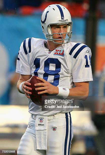 Quarterback Peyton Manning of the Indianapolis Colts warms up on the field before the start of Super Bowl XLI against the Chicago Bears on February...