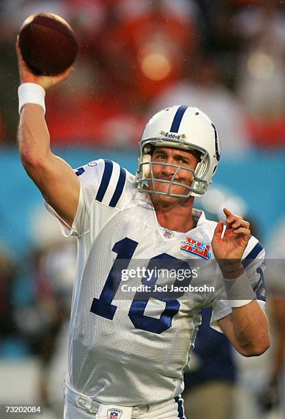 Quarterback Peyton Manning of the Indianapolis Colts warms up in the rain before the start of Super Bowl XLI against the Chicago Bears on February 4,...