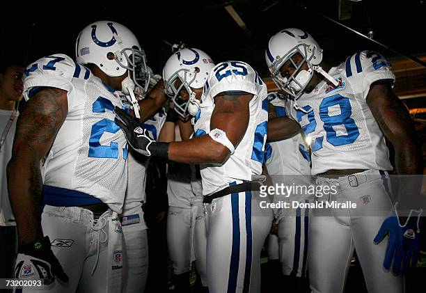 Tim Jennings, Nick Harper and Marlin Jackson of the Indianapolis Colts huddle up with teammates in the tunnel before taking the field prior to the...