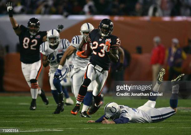 Kick returner Devin Hester of the Chicago Bears returns the opening kickoff 92-yards for a touchdown past a diving Adam Vinatieri of the Indianapolis...