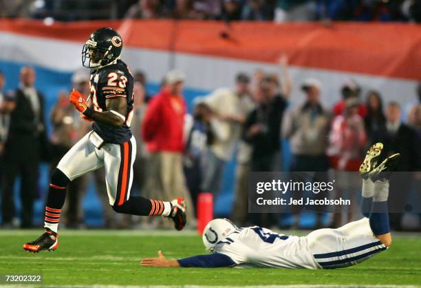 Kick returner Devin Hester of the Chicago Bears returns the opening kickoff 92-yards for a touchdown past a diving Adam Vinatieri of the Indianapolis...