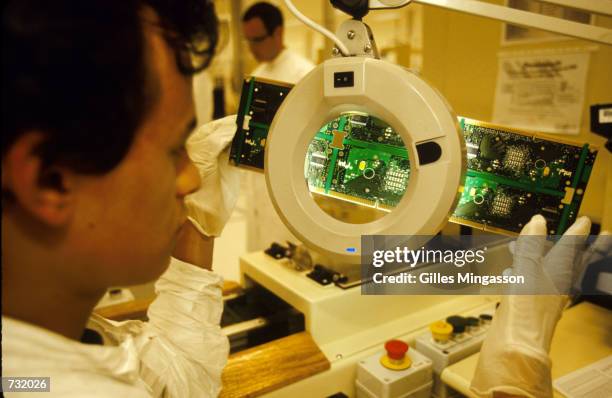 Technician works at the Intel Corporation factory August 15, 2000 in San Jose, Costa Rica. Intel is a semiconductor chip maker that supplies the...