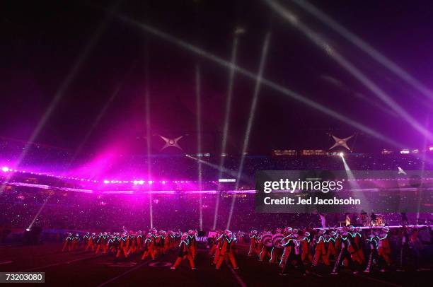 Prince performs with the Florida A&M University marching band, the Marching 100, during the "Pepsi Halftime Show" at Super Bowl XLI between the...