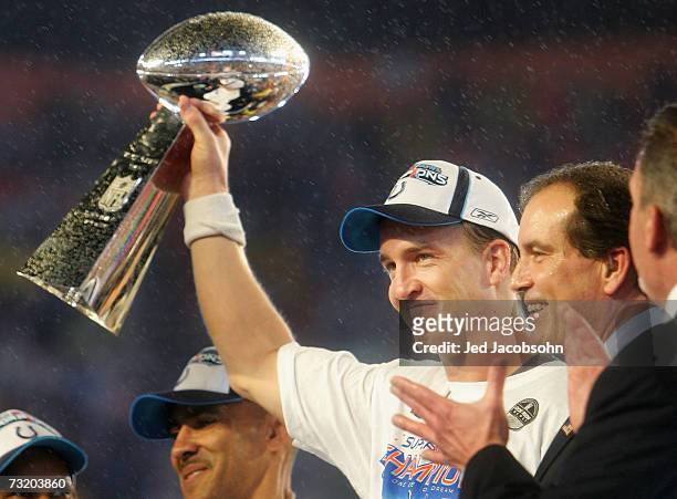 Quarterback Peyton Manning of the Indianapolis Colts celebrates with the Vince Lombardi Super Bowl trophy after winning the Super Bowl XLI 29-17 over...