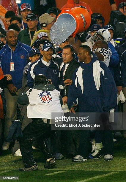 Head coach Tony Dungy of the Indianapolis Colts has water and ice poured over his head by Anthony McFarland in the final minute of the COlts 29-17...