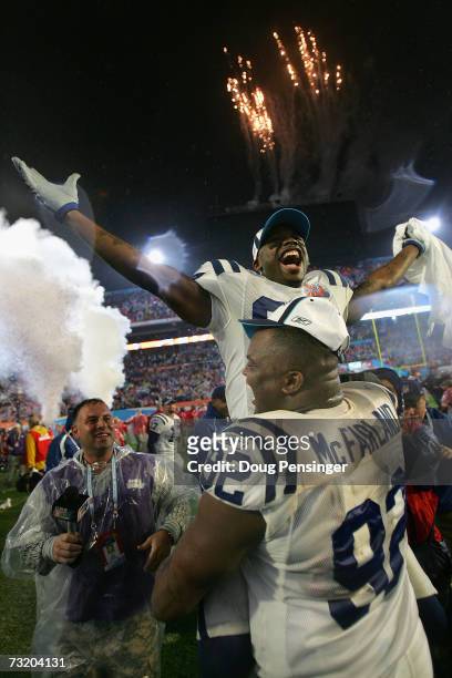 Receiver Reggie Wayne of the Indianapolis Colts is held-up on the shoulders of Anthony McFarland as he celebrates a 29-17 win over the Chicago Bears...