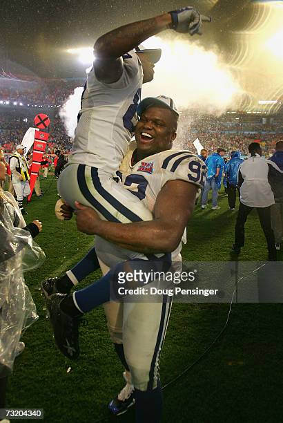 Receiver Reggie Wayne of the Indianapolis Colts is held-up on the shoulders of Anthony McFarland as they celebrate a 29-17 win over the Chicago Bears...