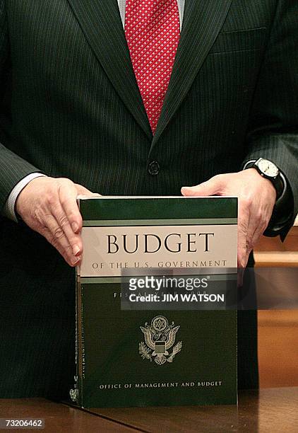 Washington, UNITED STATES: Senate Budget Committee Chairman Kent Conrad, D-ND, holds a copy of the Fiscal Year 2008 Budget from Office of Management...