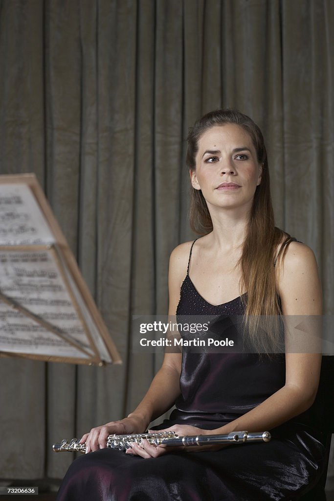 Woman holding flute