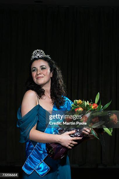 woman holding bouquet of flowers - beauty pageant stock pictures, royalty-free photos & images