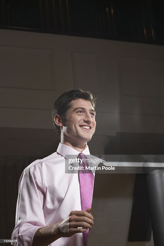 Man giving speech at podium