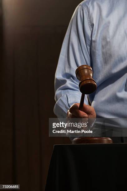 man using gavel, close-up - auctioneer stock pictures, royalty-free photos & images