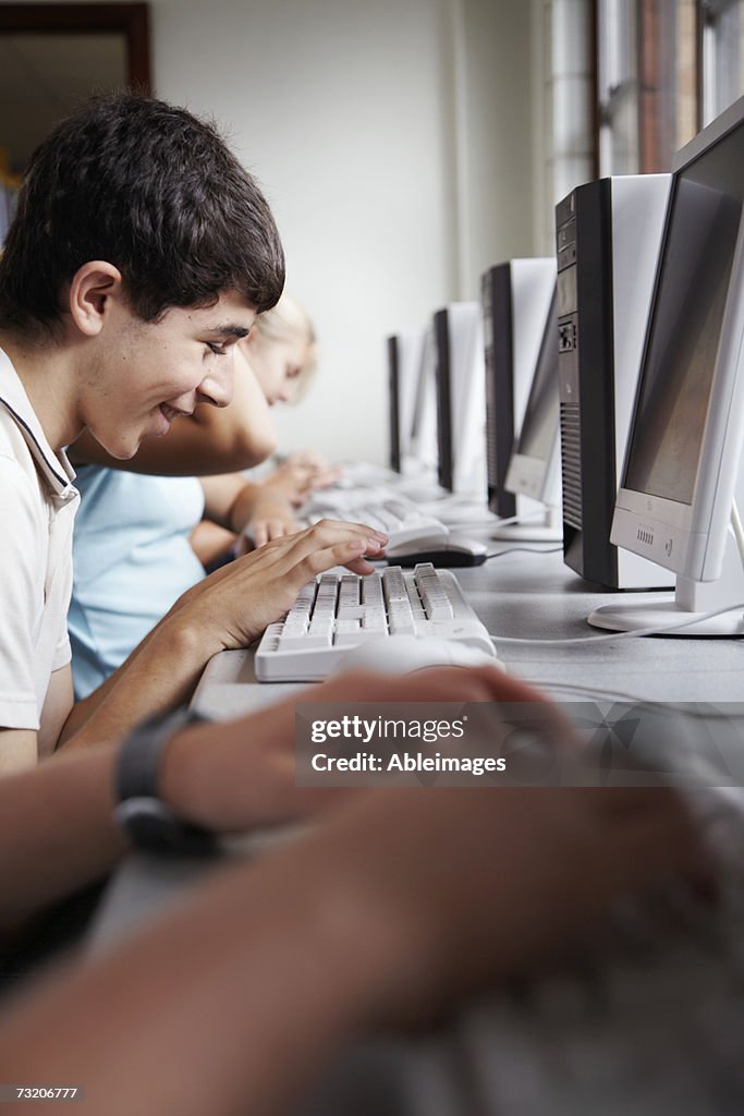 Schoolboy Using Computer Teenage Boys Using Computers At School High-Res Stock Photo - Getty Images