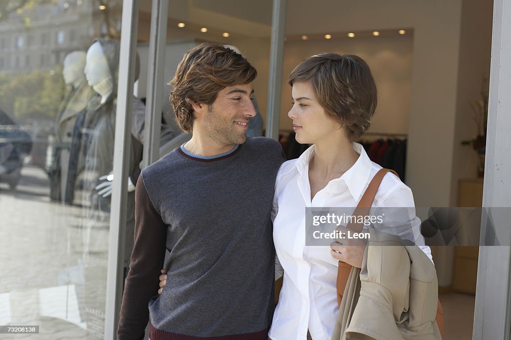 Young couple leaving shop