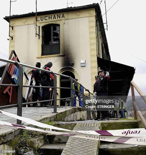 Members of the Ertzaina look for clues in Luchana railway station in Barracaldo, 05 February 2007 in Spain's northern Basque region after at least...