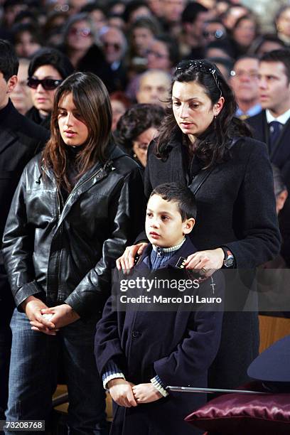 Marisa Raciti, wife of murdered Italian police officer Filippo Raciti, her 8-year-old son Alessio, and her 4-year-old daughter Fabiana attend his...