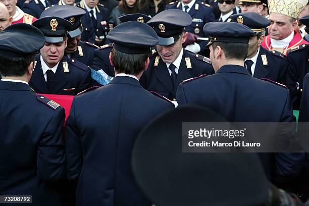 Police officers carry the coffin of officer Filippo Raciti at his funeral on February 4, 2007 in Catania, Italy. Raciti died of his injuries received...