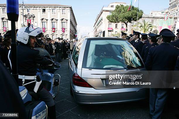 Hearse carries the coffin of officer Filippo Raciti at his funeral on February 4, 2007 in Catania, Italy. Raciti died of his injuries received during...