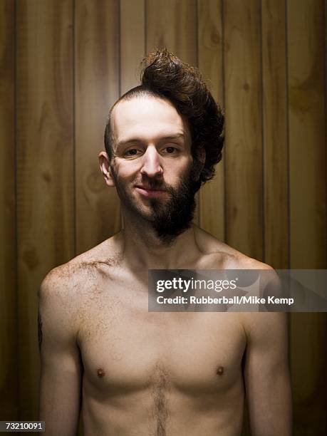 man with half shaved head and beard half smiling - half shaved hair stockfoto's en -beelden