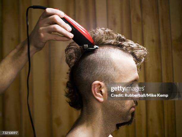 man with half shaved hair and beard - half shaved hair stockfoto's en -beelden