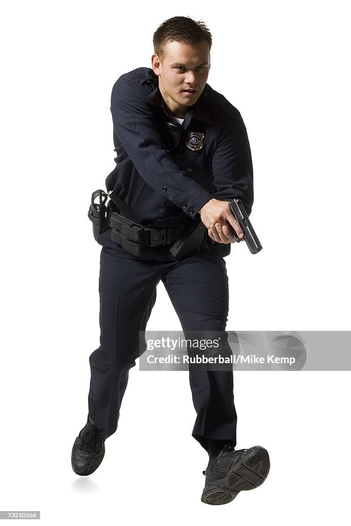 Male police officer pointing gun
