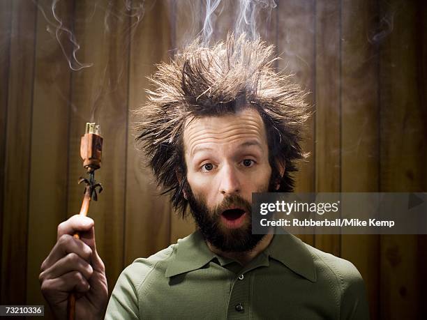 https://media.gettyimages.com/id/73210336/photo/man-after-electric-shock-with-electric-plug-and-smoke.jpg?s=612x612&w=gi&k=20&c=YMI4RaZKWgSHkKq8Z_wUPqGanrHPj502tHP0zXjrmcw=