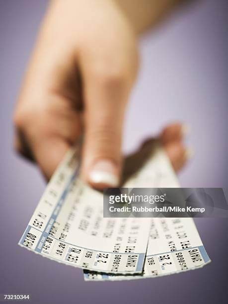 woman giving tickets - concert ticket stock pictures, royalty-free photos & images
