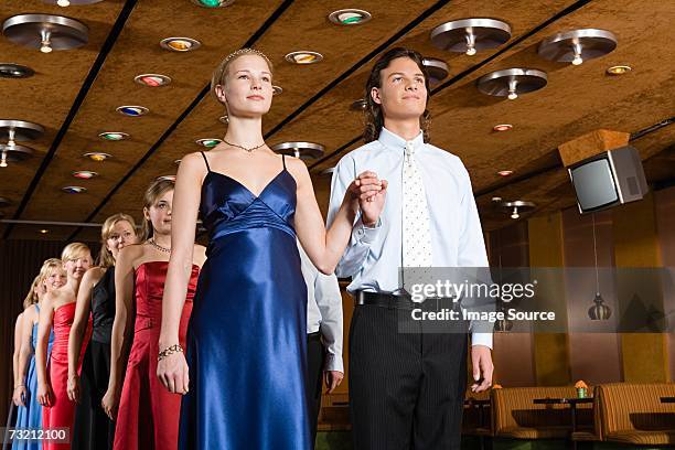 teenagers in a row - prom stock pictures, royalty-free photos & images