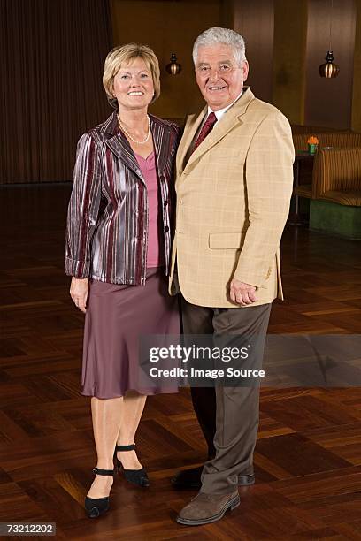 senior couple in hall - ballroom stock pictures, royalty-free photos & images