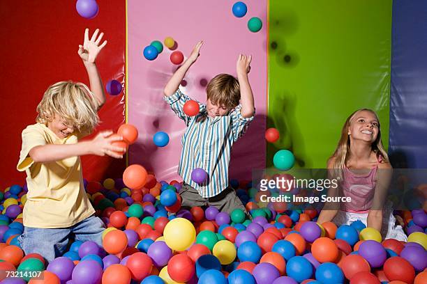 kids playing in ball pool - ball pit stock pictures, royalty-free photos & images