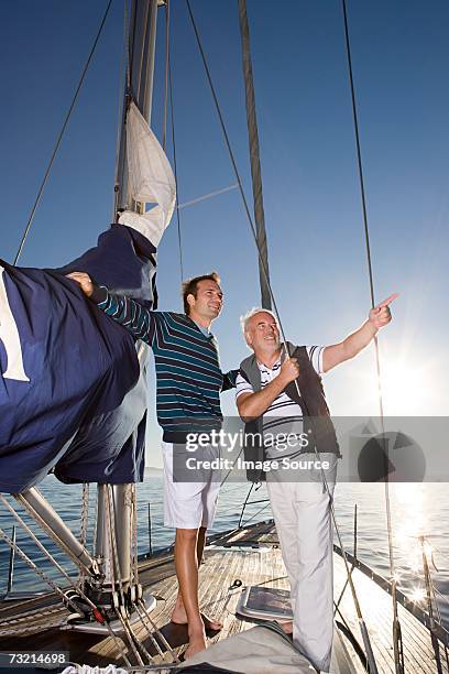 father and son sailing - father son sailing stock pictures, royalty-free photos & images