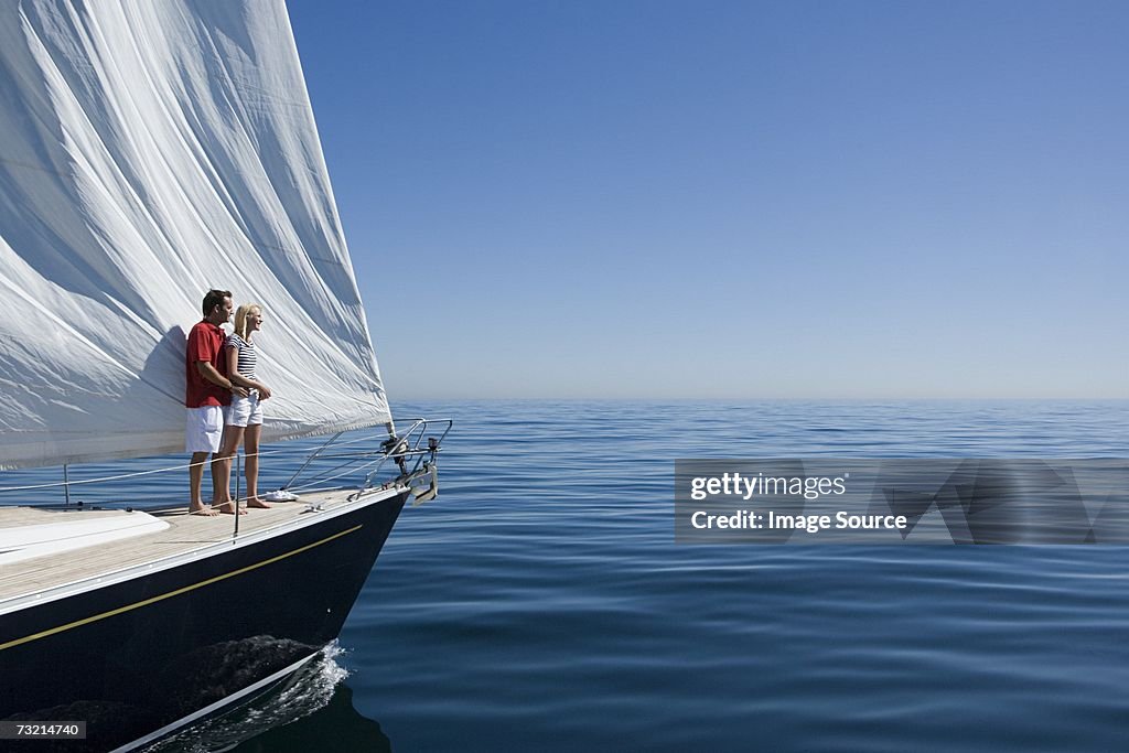 Couple standing on a ships bow