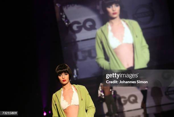 Models perform on stage during a fashion show during GQ Ispovision Style night, February 5 in Munich, Germany.
