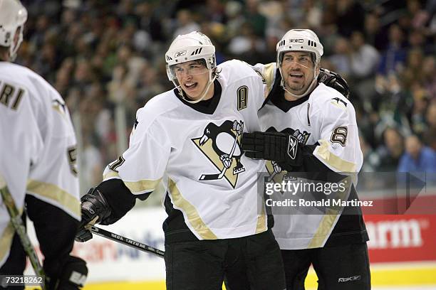 Sidney Crosby and Mark Recchi of the Pittsburgh Penguins celebrate against the Dallas Stars at American Airlines Center on January 26, 2007 in...