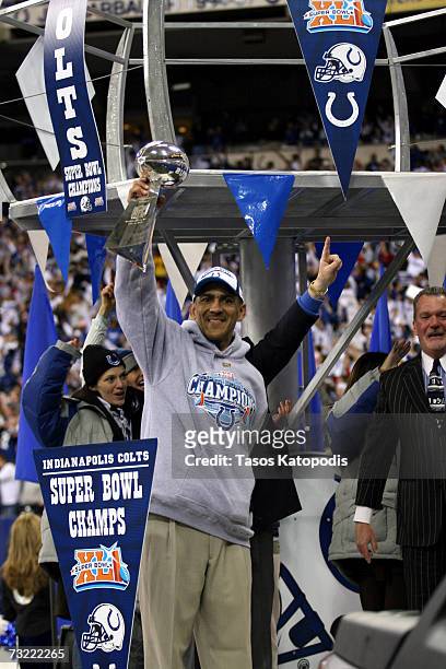 Indianapolis Colts Head Coach Tony Dungy shows the Vince Lombardi Trophy to the packed crowd of fans, as he and his team celebrate their victory at a...