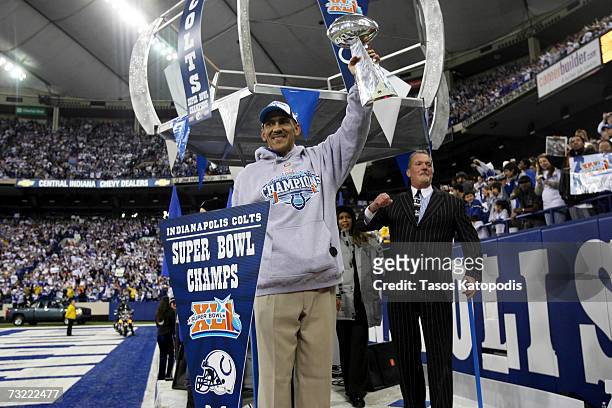 Indianapolis Colts Head Coach Tony Dungy holds the Vince Lombardi Trophy to the packed crowd of fans while Colts owner Jim Irsay cheer as they and...